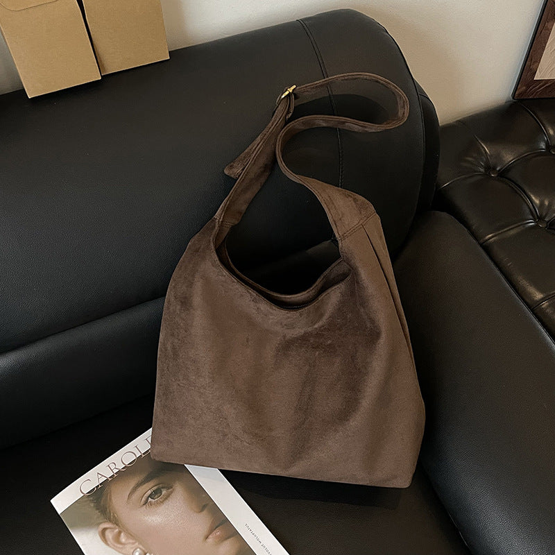 The Plot-Pivot Suede Carryall: The Only Baggage You’ll Actually Enjoy Carrying