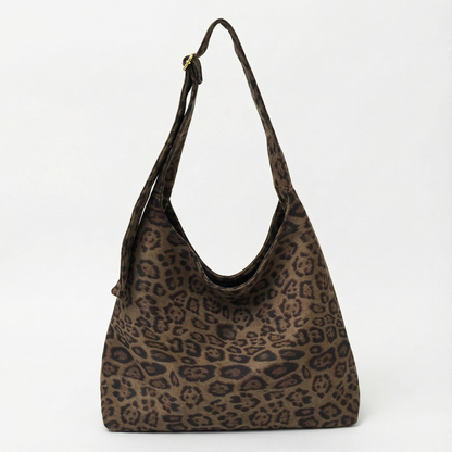 The Plot-Pivot Suede Carryall: The Only Baggage You’ll Actually Enjoy Carrying