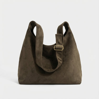 The Plot-Pivot Suede Carryall: The Only Baggage You’ll Actually Enjoy Carrying