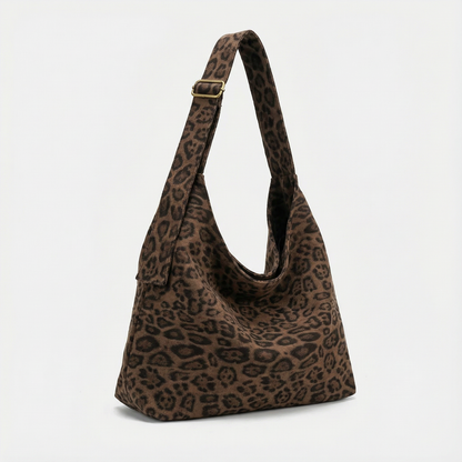 The Plot-Pivot Suede Carryall: The Only Baggage You’ll Actually Enjoy Carrying