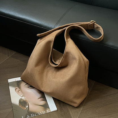 The Plot-Pivot Suede Carryall: The Only Baggage You’ll Actually Enjoy Carrying