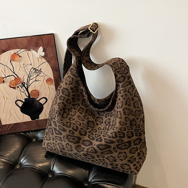 The Plot-Pivot Suede Carryall: The Only Baggage You’ll Actually Enjoy Carrying