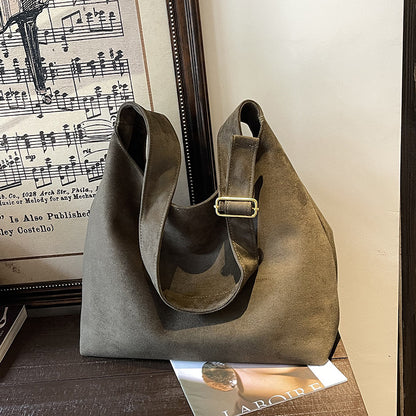 The Plot-Pivot Suede Carryall: The Only Baggage You’ll Actually Enjoy Carrying